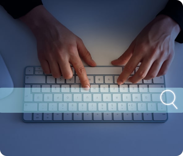 A user searches the internet with a holographic search bar across the keyboard.