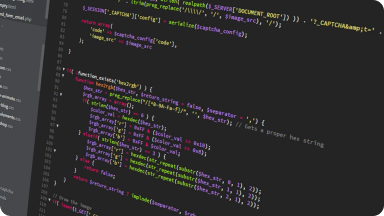 Website development starts with code structure as seen on a monitor.
