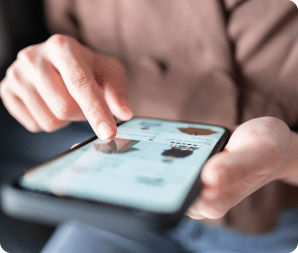 A cellphone with a person scrolling an ecommerce website