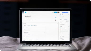 Open laptop displays the backend of a WordPress content page for development.