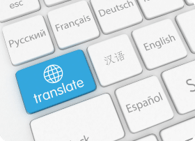 A keyboard with a blue translate button with other keys in international languages.