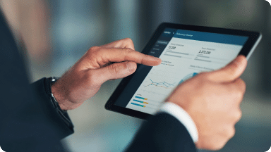 iPad displays various website traffic metrics as the user scrolls through.