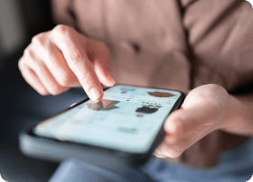 Person using mobile phone for social media paid ads to increase visibility.