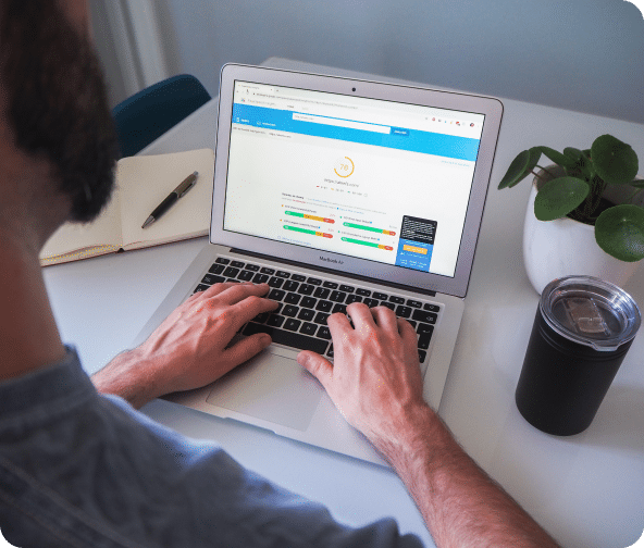 Pagespeed shows core web vitals dashboard on laptop screen.