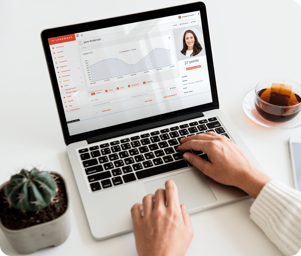 Person check their personalized Landmark insights and reporting.