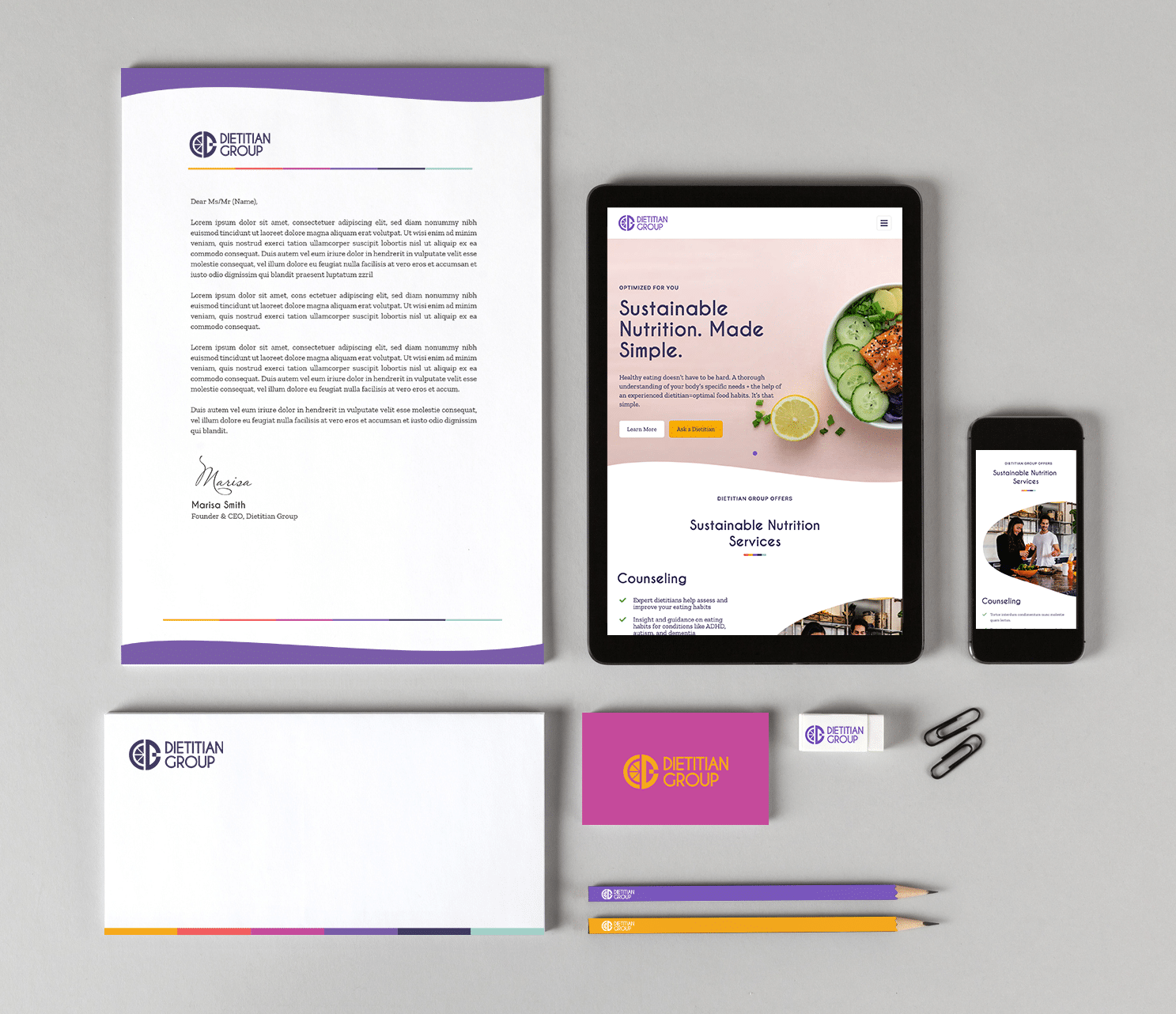 Dietitian Group stationary items with website homepage displayed on mobile and tablets.