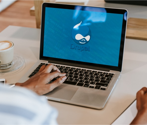 Drupal tear drop logo on laptop.