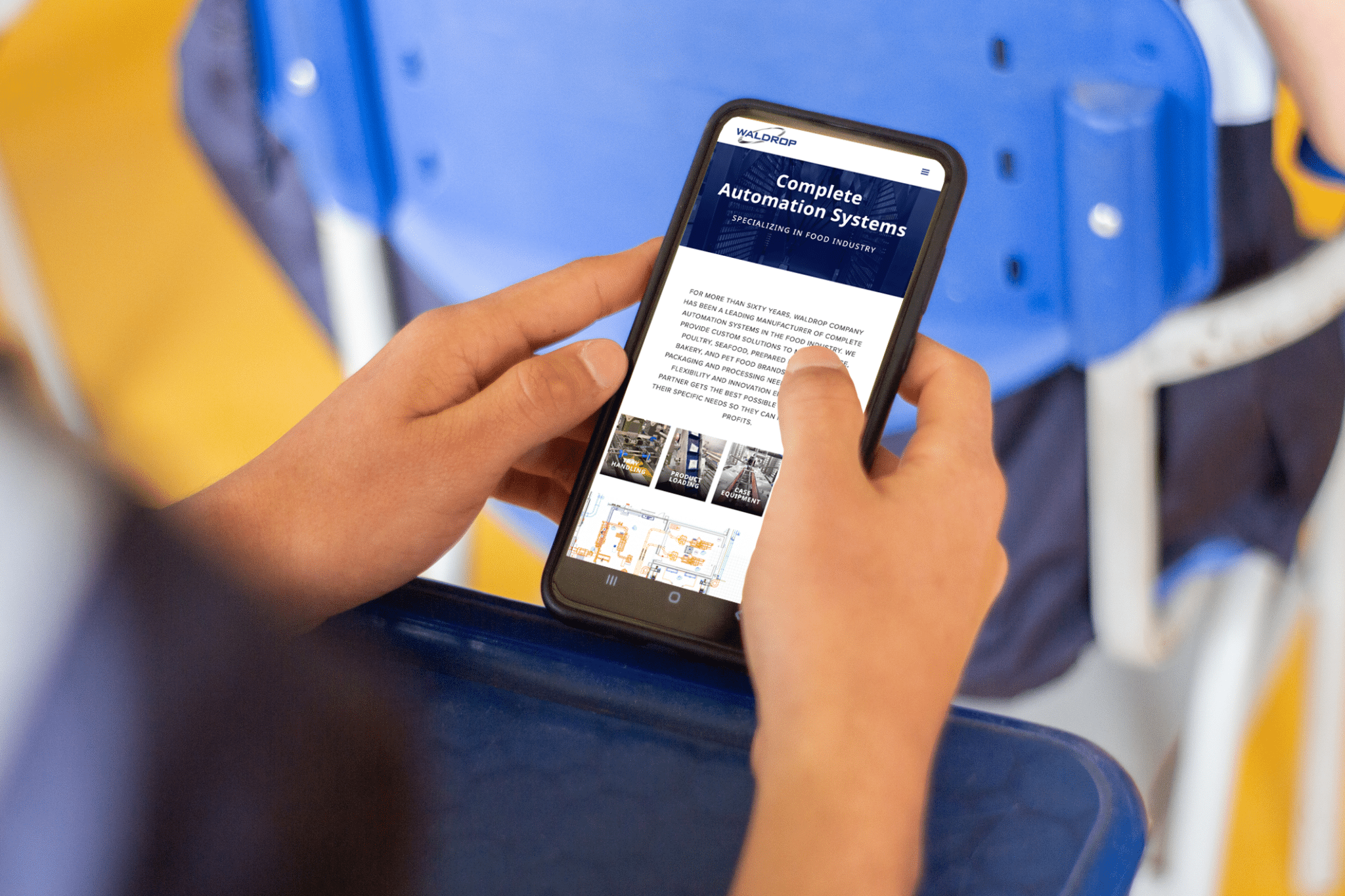 Person holds mobile phone with Waldrop Complete Automation Systems webpage in view.