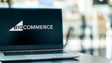 BigCommerce logo displayed on an open laptop.