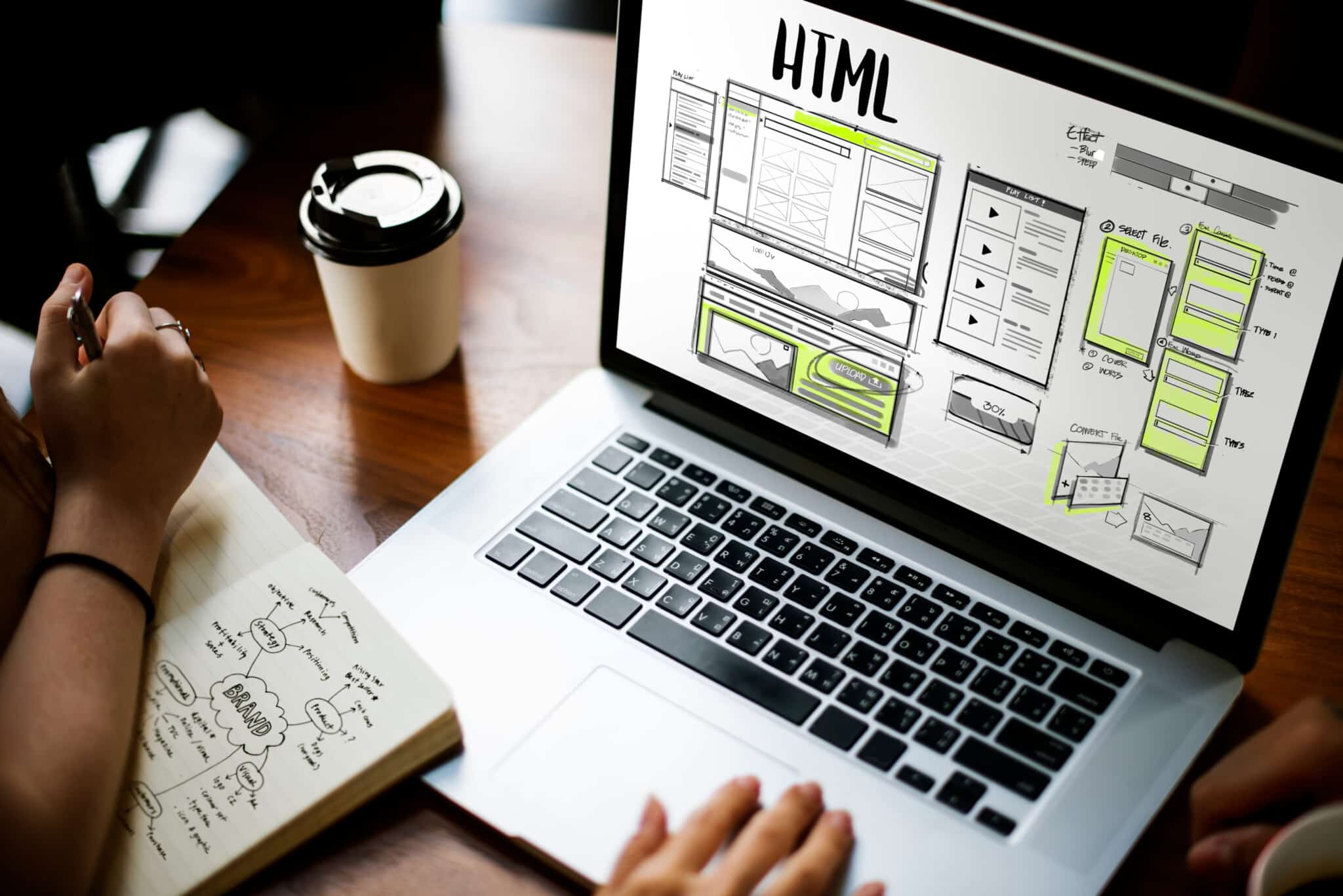 Plan Left design team reviews eCommerce website strategy on laptop.