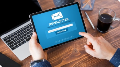 User signs up for a newsletter on a tablet.