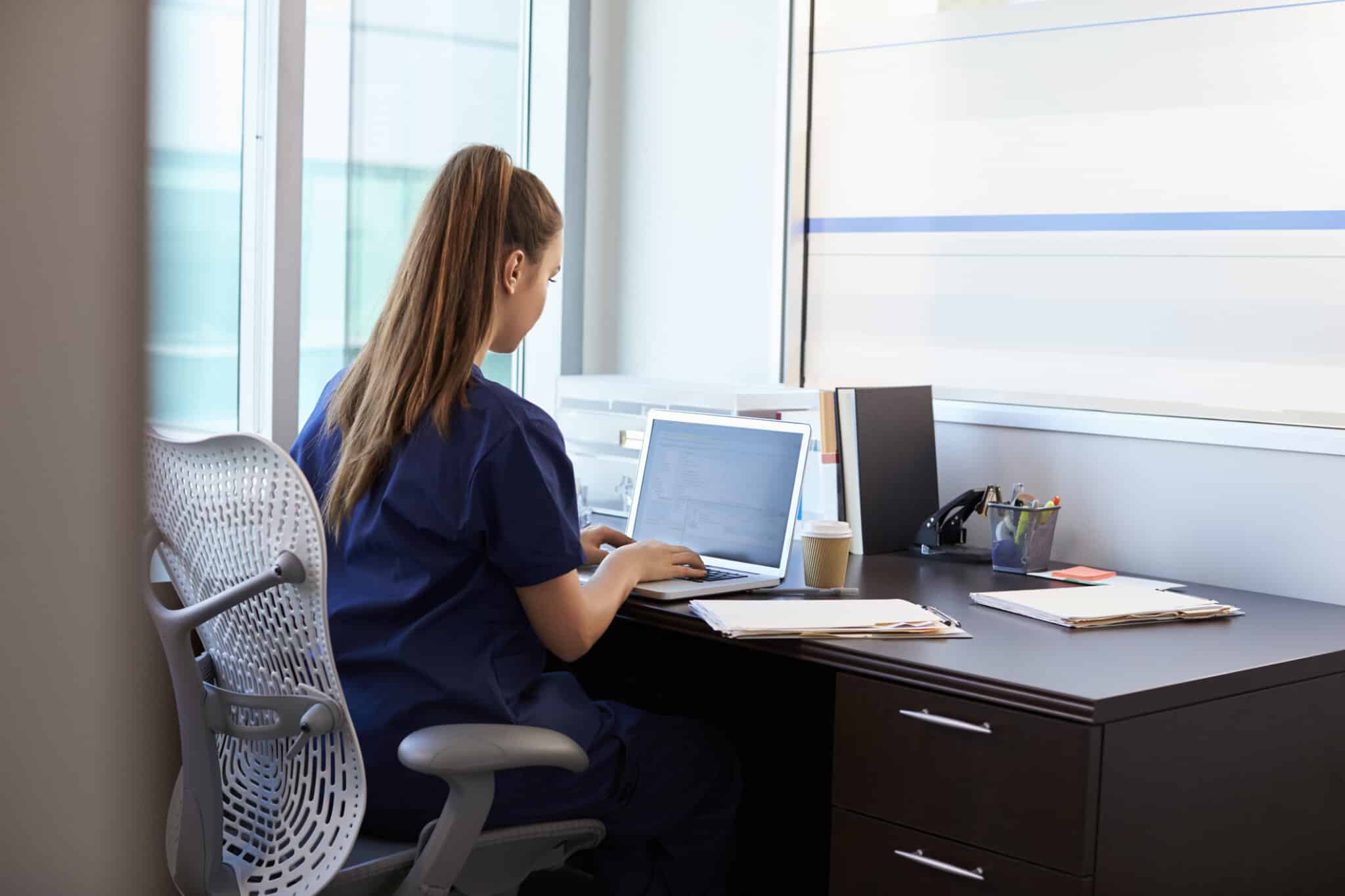 Nurse chats with Plan Left team uptraining on new medical practice patient portal.