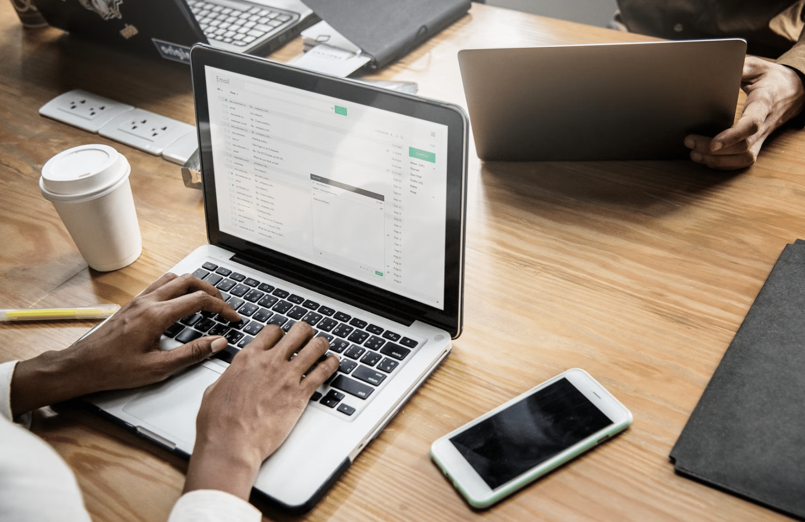 Physician emails with Plan Left augment team, strategizing on new medical practice website.