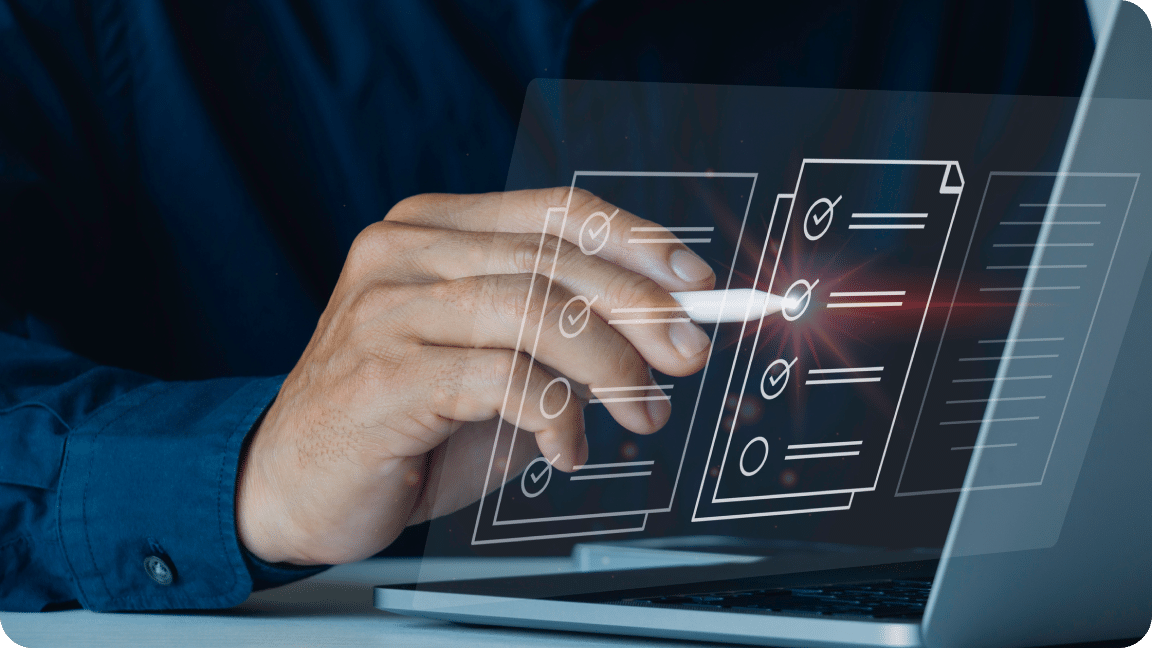 Hand of a man with a white touch pen clicking a tick mark on a laptop checklist list depicting CRM Audits done by Plan Left.