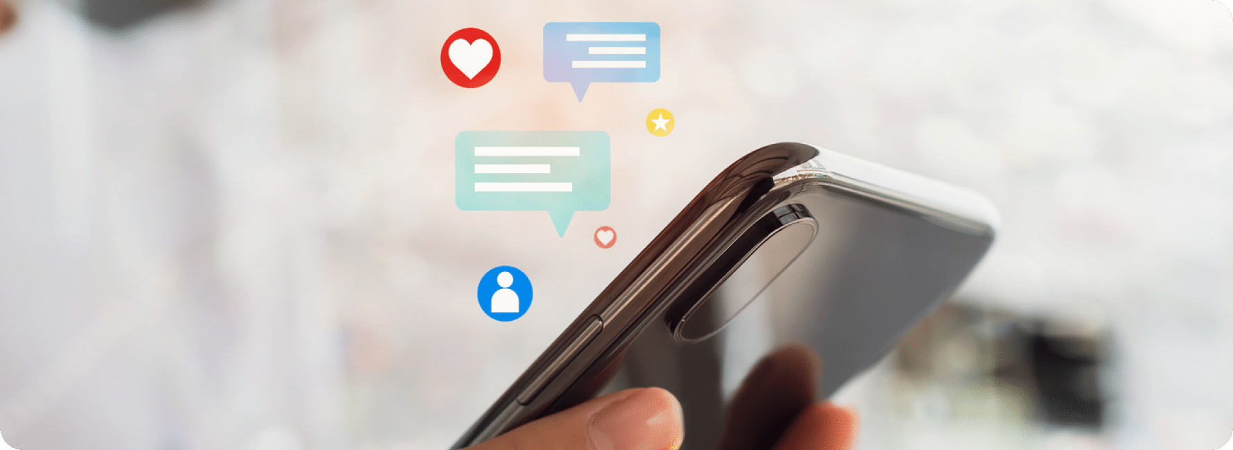 Cellphone with chat icons, person icons, heart bubbles and stars above it.