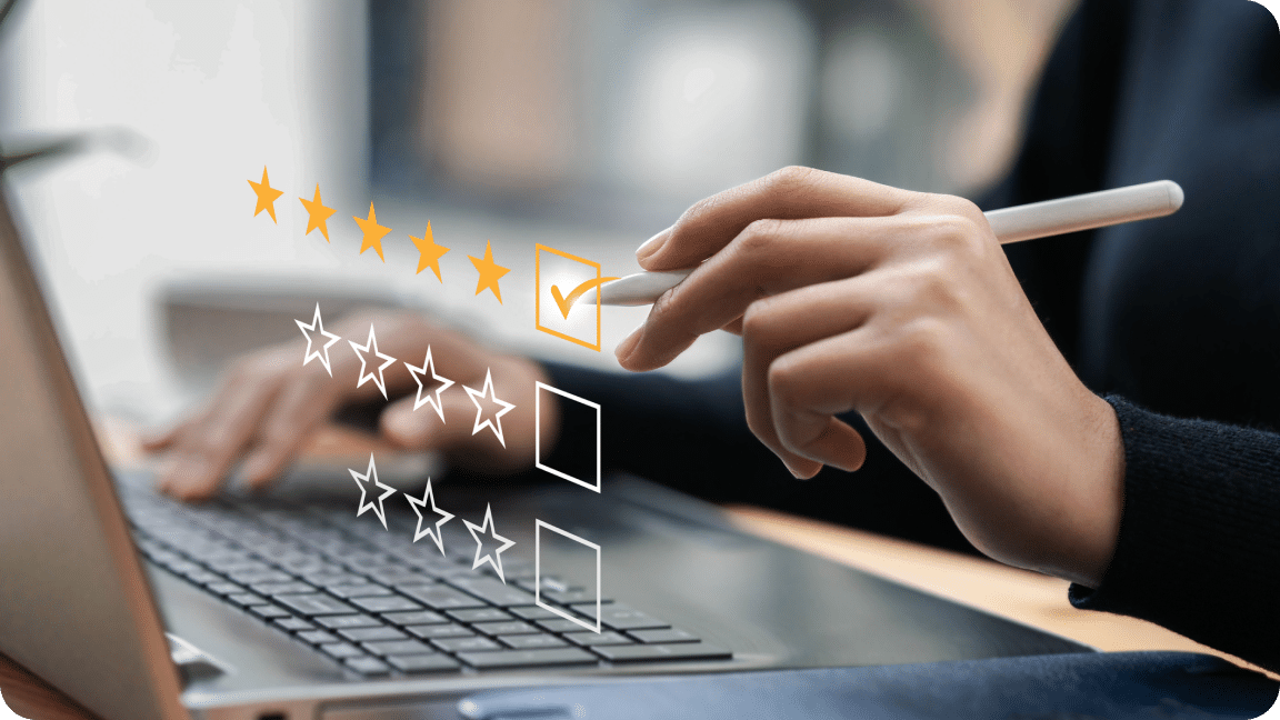 Checkboxes with rating stars hover above a keyboard with a pen marking the 5 star rating.