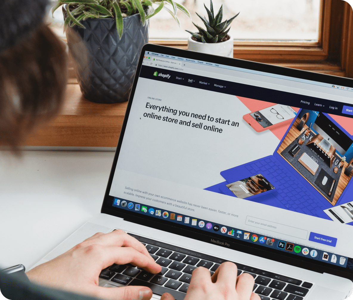Shopify website page for starting your online store displayed on a laptop with user typing.