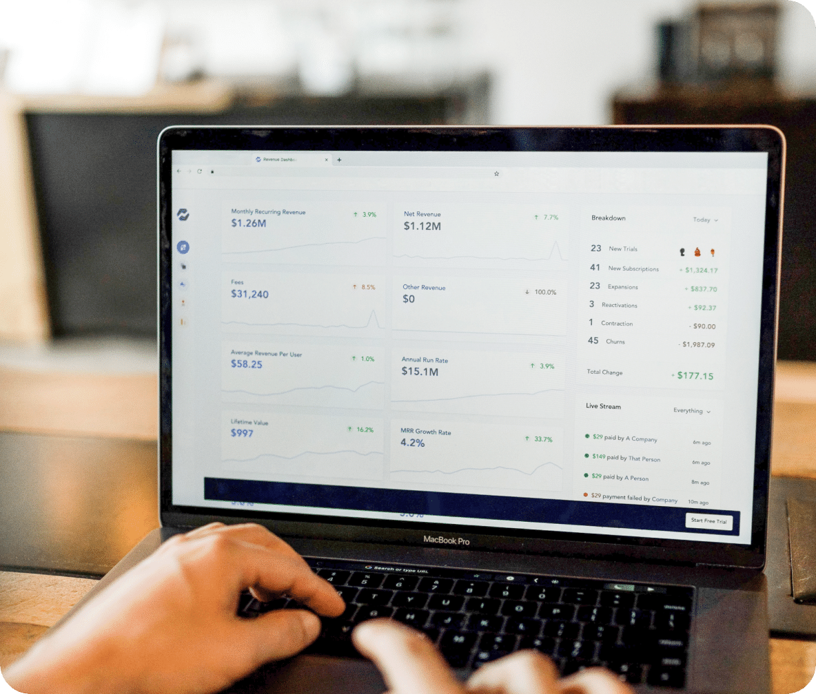 Breakdown of costs and earnings in a dashboard displayed on laptop screen.