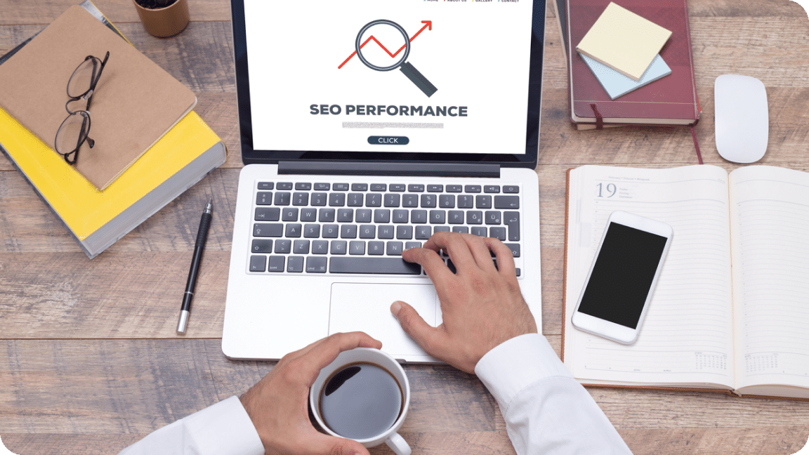 Open laptop displaying SEO Performance on the screen with a magnifying glass and red arrow moving up.