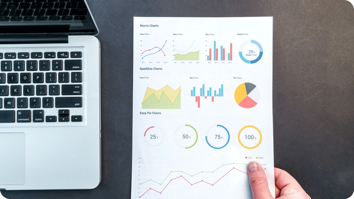 Paper held that shows graphs and metrics for content SEO scores after audit.
