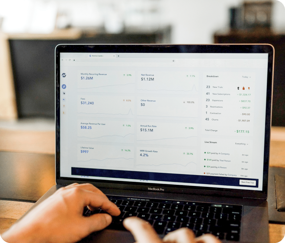Laptop displays pay per click metrics and report outcomes.