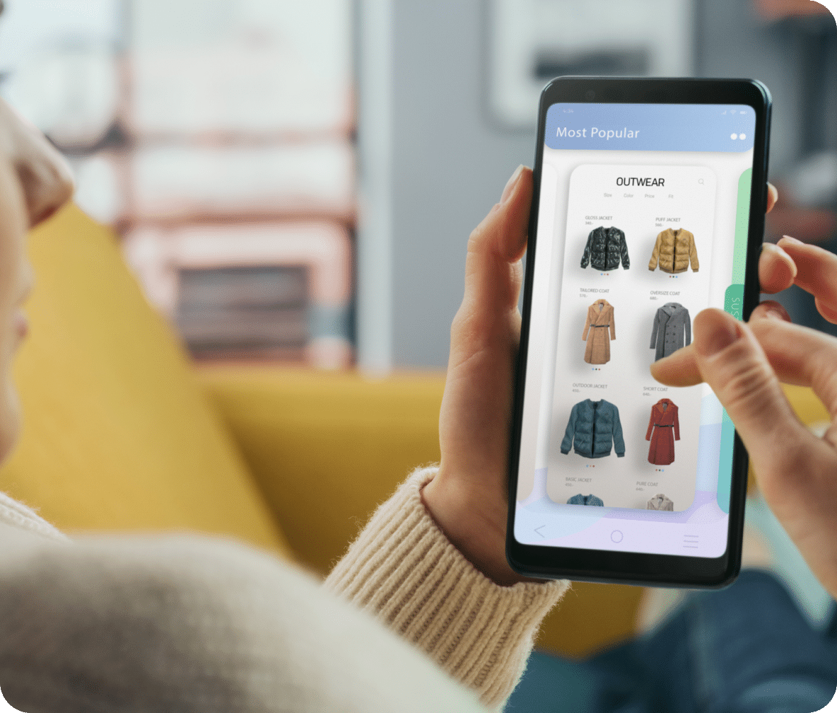 Person scrolls through a shopping website for outerwear on their cellphone.