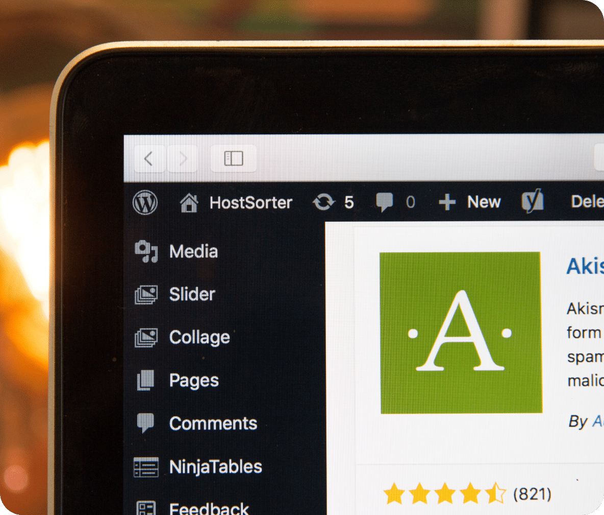 Laptop screen corner with WordPress dashboard displayed showing the logo of a plugin.