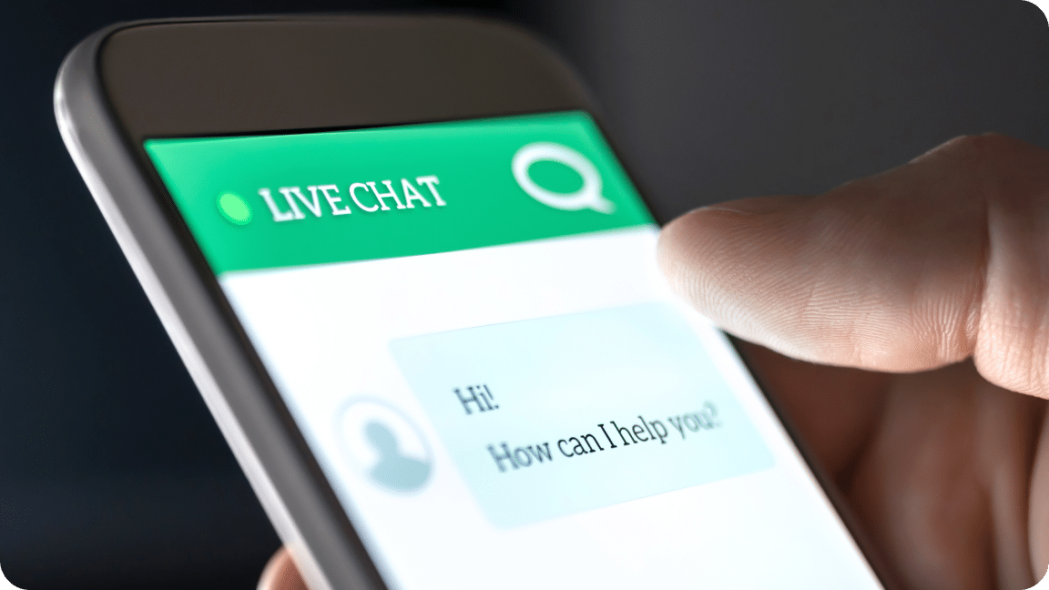 Mobile phone with live chat across the top in white font, chat bubble below it.