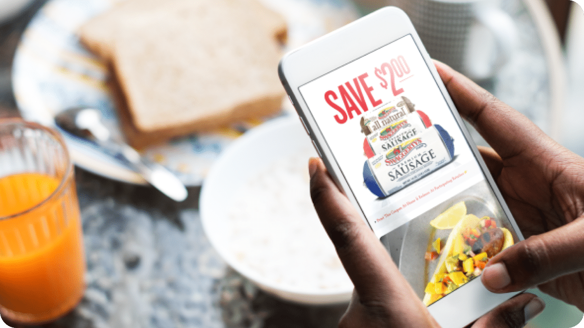 Person checks coupon deals on Swaggerty's Sausage Loyalty App.