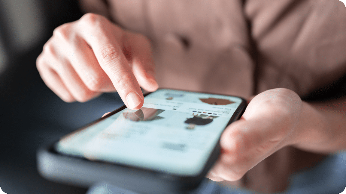 Person scrolls through an eCommerce website on their mobile phone.
