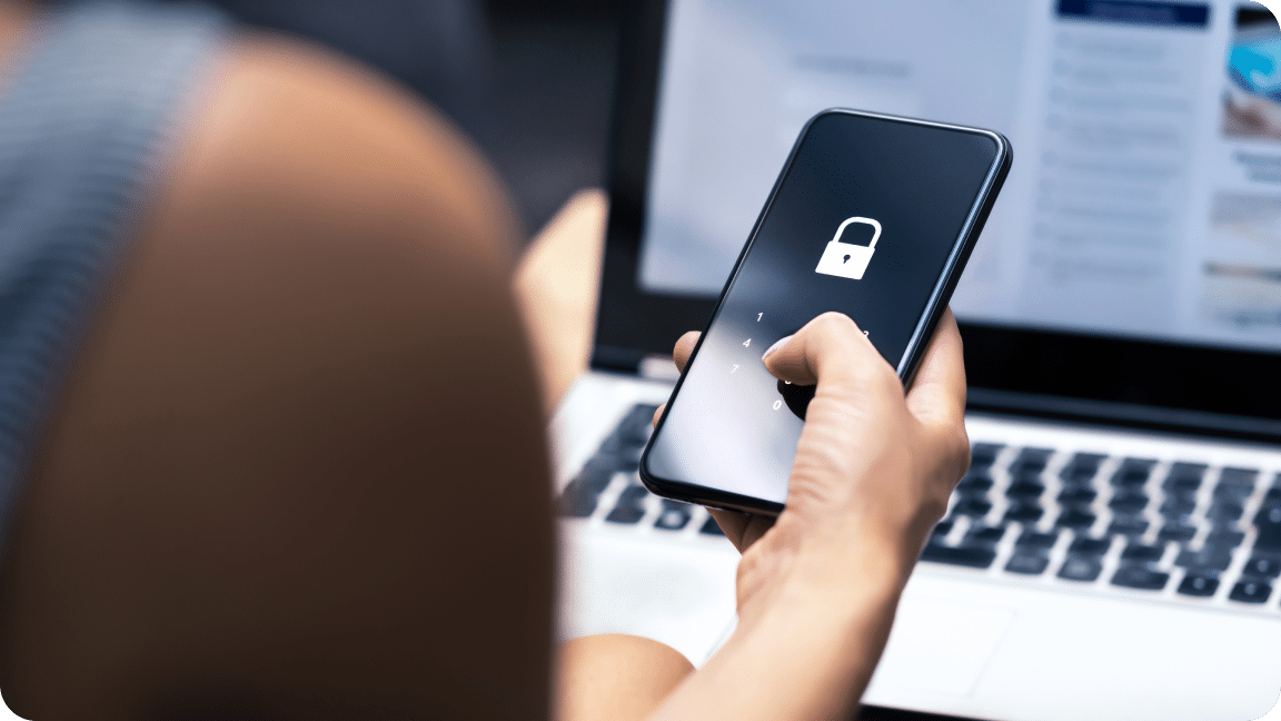 Hand holds a smartphone with a locked screen, requesting password authentication.
