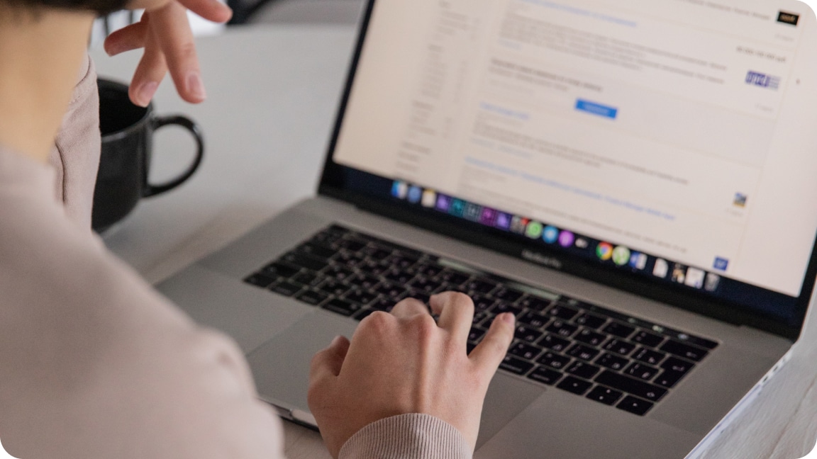 An open laptop with the backend of a website dashboard open with a user navigating the cursor.