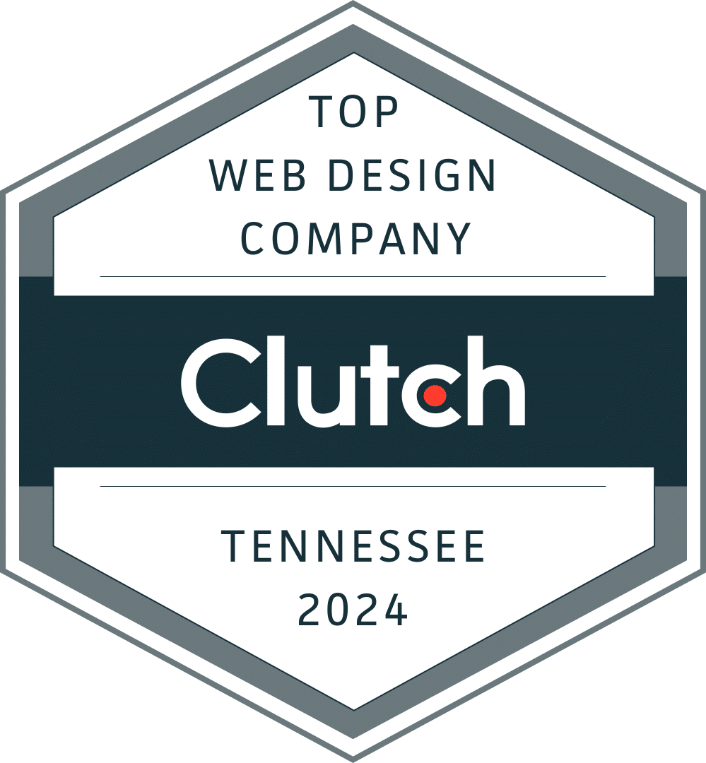 A hexagonal badge with "Top Web Design Company Tennessee 2024" in navy blue and "Clutch" in white font in a navy blue block in the middle.